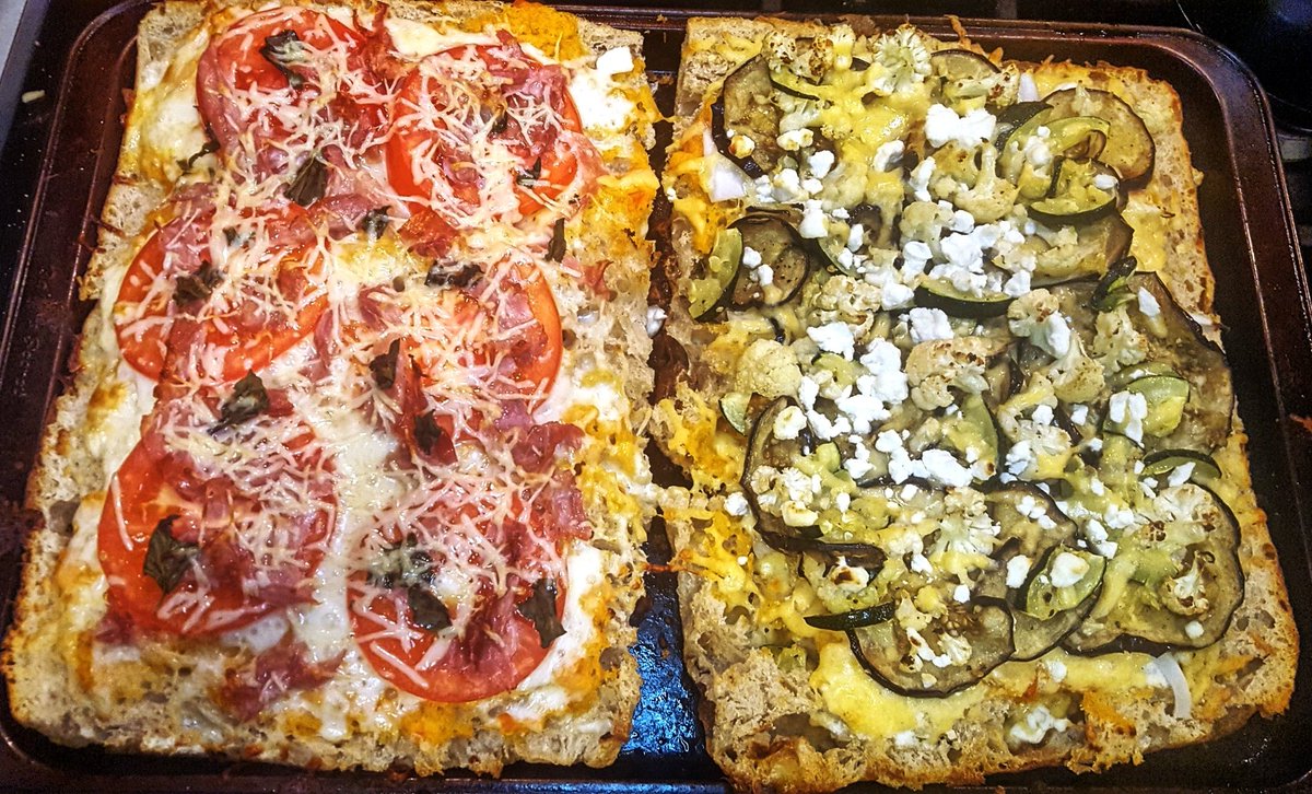 SoGoodCooking1's tweet photo. Last night we had focaccia pizza: on the left, tomato, basil, prosciutto w/ mozz and parm. On the right, roasted eggplant, cauliflower, zucchini with goat cheese and gouda. Simple, bright tomato sauce on both. Delicious &amp; flavorful!

#June1st #FoodPorn #pizza #RecipeOfTheDay https://t.co/YHwIKDT2Gw