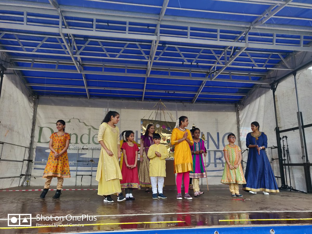 DudhopeCentre's tweet photo. Dudhope Multicultural Centre young people and their teachers at #dundeedesignparade today in the city centre. They build up a Shiva temple 😍 with recycled paper and CD and performed a new dance. https://t.co/cfCZHl3EuX
