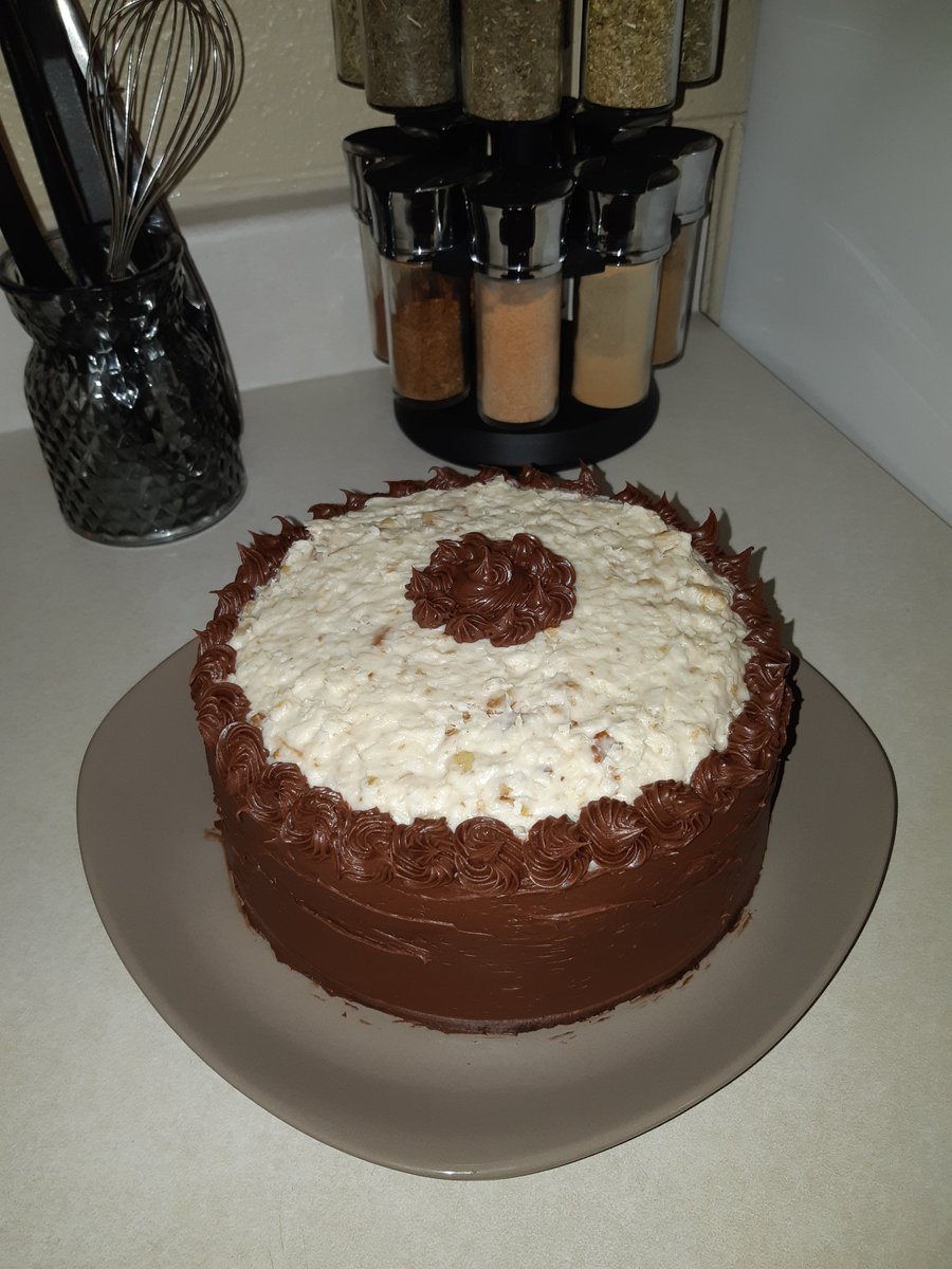 AFHenley's tweet photo. The recipe said it was called German chocolate cake. How could I not try to make it? Although my middle design could have been a little less... uhmm... well, you know. Not sure what to do with it now, though. #homemade #baking #fornogoodreason https://t.co/k9BrBYH47D