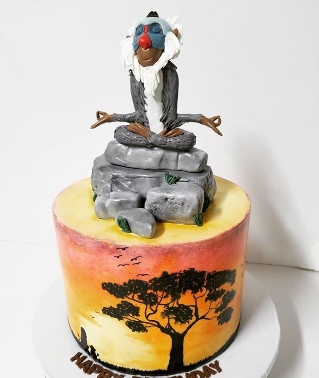 cupcakewench's tweet photo. I woke up under the weather this morning. Trying to stay zen like Rafiki here considering all the orders I need to get done! 
This cake featured a sugar Rafiki and handpainted scenery.

#cupcakewench #trinidadandtobago #BeautifulDessertsExceptionalTaste #birthdaycake #satini… https://t.co/wmivVDHJtC
