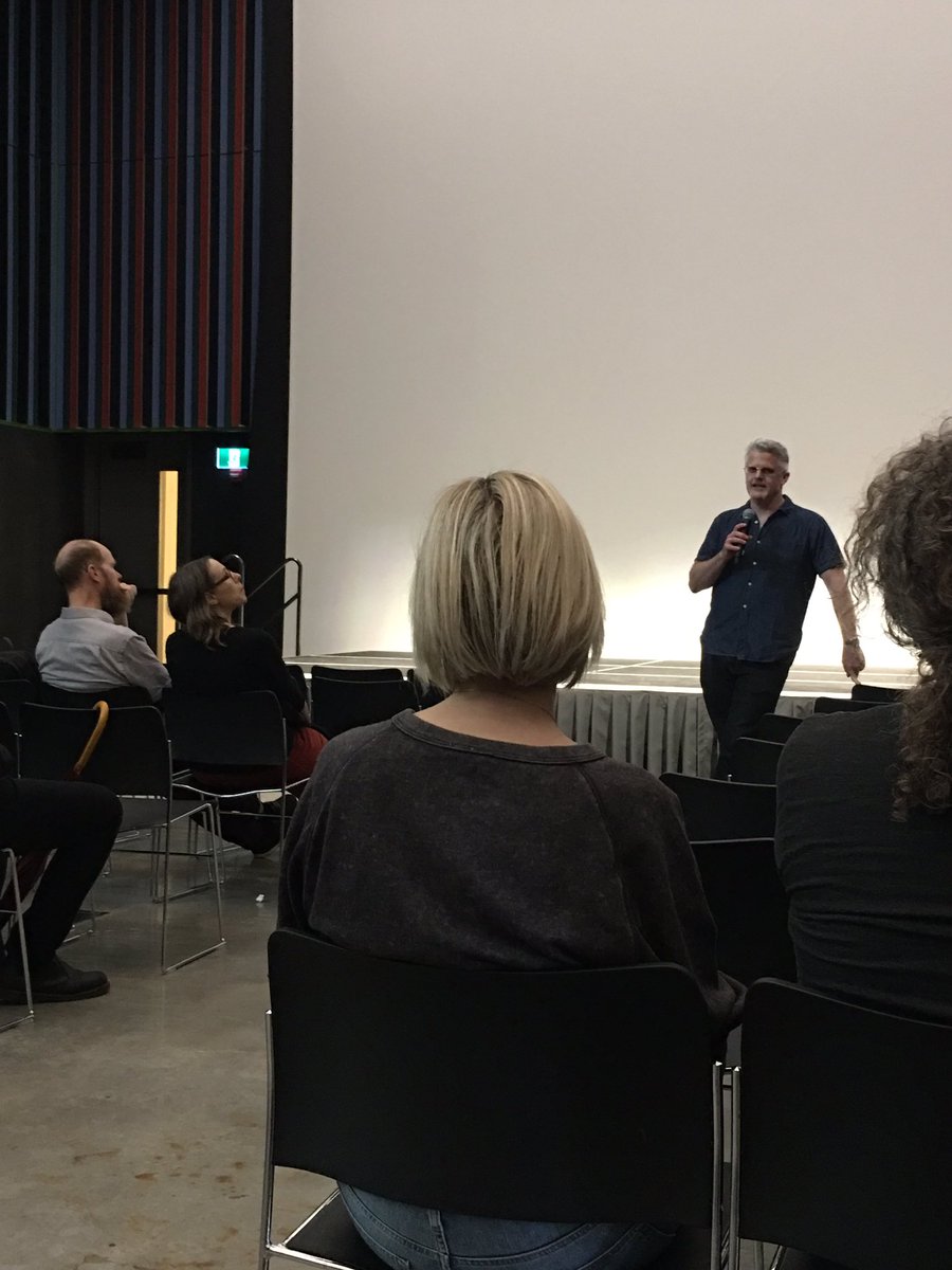 UofTDaniels's tweet photo. Megalodemocrat is about to start in our Main Hall. But first! Director Benjamin Duffield gives a brief introduction and insight into the making of the feature-length documentary. #DOT19 #OneSpadina #uoftdoorsopen #publicart https://t.co/cP2ViCiNyA