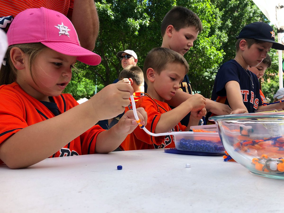 CovestroBaytown's tweet photo. We’ve got a line of happy kids making solar activated bracelets at the @astros #BayouBash next to the @EVGrayWetlands Cleaner Energy, Brighter World #sustainability exhibit. They are learning how to make our world a brighter place! #CoveSTROS #CovestroCares https://t.co/mD2Az0uIlv