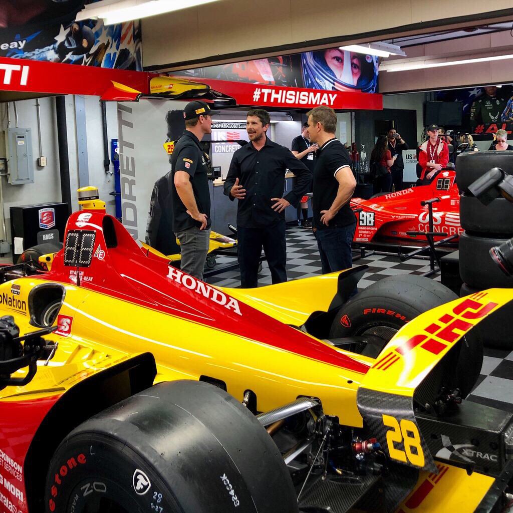 FordvFerrari's tweet photo. Co-Honorary Starters (and Co-Stars) Matt Damon and Christian Bale talk to press, meet drivers and go for a hot lap with racing legend Mario Andretti at @IMS. #FORDvFERRARI #Indy500 https://t.co/Y9l23BB34C