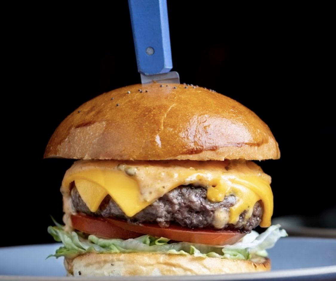 <a href="/republiqueLA/">République L.A.</a>’s dry-aged beef burger 🍔 Beef patty made with equal parts short rib and Prime dry-aged rib-eye, topped with American cheese, caramelized onions, and special sauce on a pain de mie. Head to dineLABurgerTrek.com to see our full guide! #dineLABurgerTrek