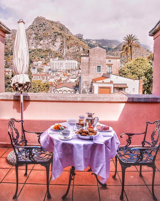 SilverSpoonLDN's tweet photo. Breakfast with a view! Our stunning balcony at @belmondgrandhoteltimeo has a view over the town of Taormina #SilverSpoonStories #TheArtofBelmond #BelmondPostcards #Sicily #Babymoon #Babymooning https://t.co/TD6kIu79A0 https://t.co/rQ67q6mggj