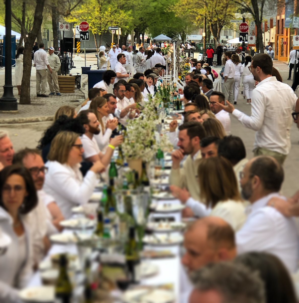 BrianTDBowman's tweet photo. Dinner last evening with 1,200 of my closest friends. One of the world’s longest dining tables was set up in Winnipeg’s historic Exchange District last evening. Thanks @storefront_mb! #TableFor1200More https://t.co/YJFuEgvSC3