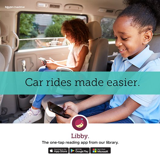 two young girls looking at electronic devices in the back seat of a car. both of them are smiling