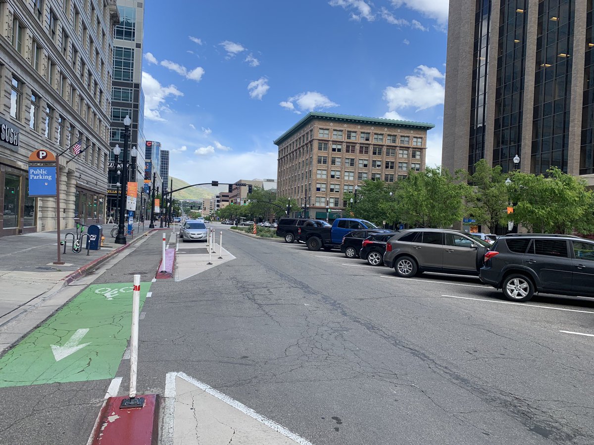 Derailluer's tweet image. The nation’s 2nd #protectedintersection Salt Lake City, cerca 2015. Showing some age and on a Sunday afternoon, not busy. But streets super calm and bars busy. Kinda dig diagonal parking placed in middle of street