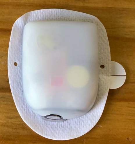 The Omnipod is a small insulin pump that you can stick on your body. it is a white rectangle with adhesive on the back.