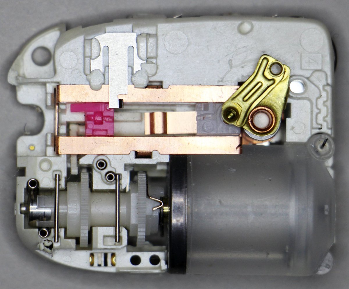 The inside of the Omnipod contains an insulin reservoir, pump, gears, and a crankshaft to drive a needle.