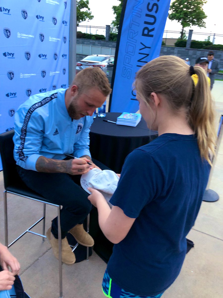 SportingKCSTM's tweet photo. Hat trick 🎩🎩🎩 Johnny signing hats at our STM Meet & Greet. #Russellmania #SportingBlue https://t.co/CITRIdLQYW
