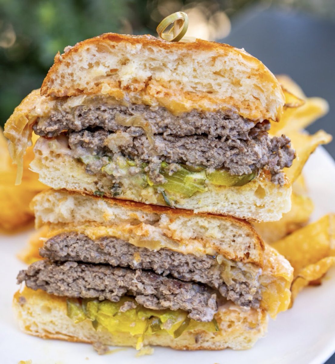 dineLA's tweet photo. In Venice? #TheRoseVenice features a double smash burger on their lunch and brunch menus. This #dineLABurgerTrek favorite comes with twin patties topped with smoked cheddar, pickles, caramelized onions, and special sauce. Let us know your favorite #dineLABurgerTrek burgers!โจ https://t.co/82c4qLOo6F