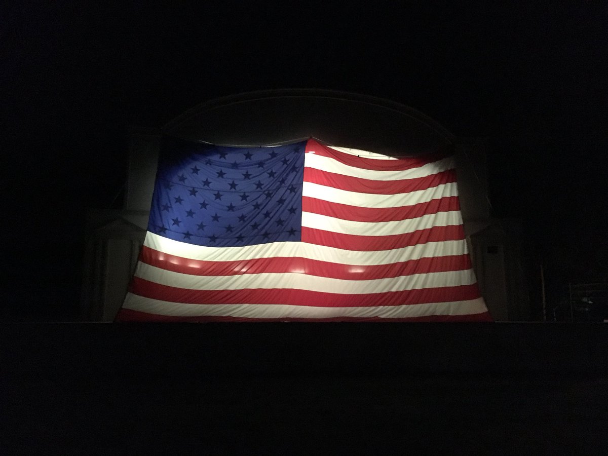 American Legion members with the help of Hugeback-Johnson flag have Mikkelson Park in a patriotic mood the night before Memorial Day.