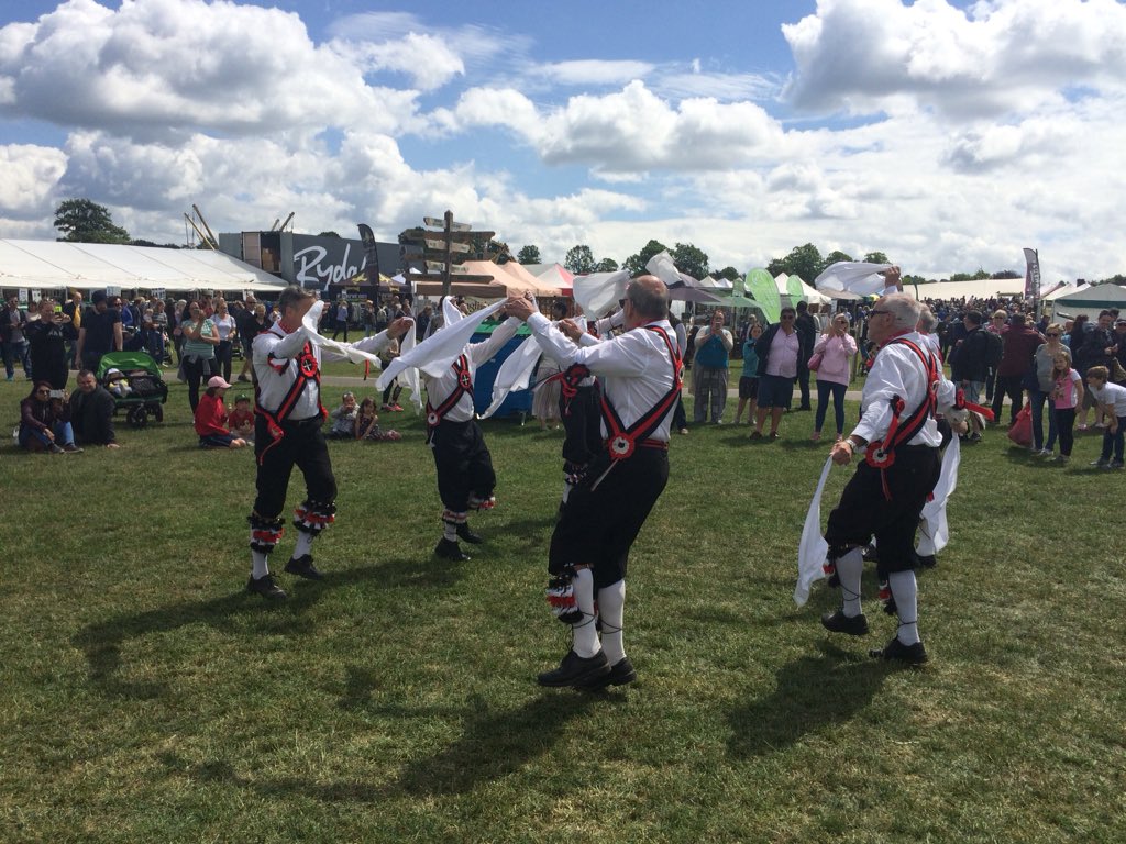 BBCSurrey's tweet photo. The Morris dancers have arrived at Stoke Park. Can we get @AllisonFerns1 to partake in some dancing again this year at the #SurreyCountyShow? Full coverage throughout the day on @BBCSurrey. https://t.co/R6LXCsKvdK