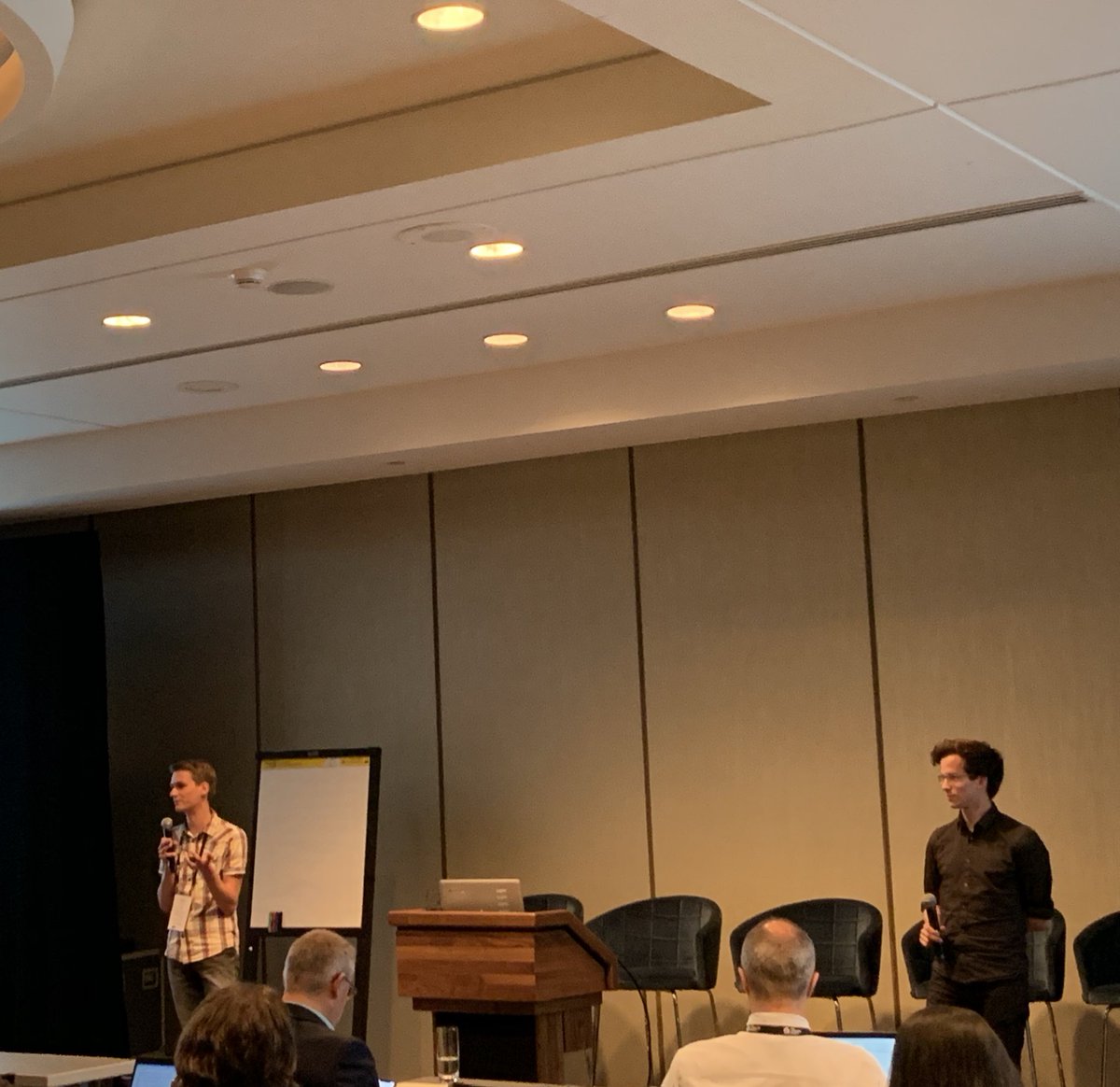 TechDebtConf's tweet photo. Sander Meester &amp; Simon Baars, two of our travel award recepients, presenting their Minecraft implementation of code quality analysis: Code Arena, stop by at the break in room Viger to see a demo #techdebt19 https://t.co/7kAJBNQRsV