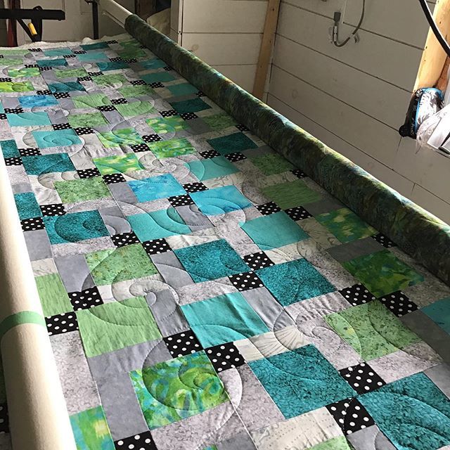 andrea_r's tweet photo. Swirls like waves over this disappearing nine patch in reals and greens and greys. Thread colour is lagoon. #glide #apqs #freehandquilting #longarmer #customerquilt via Instagram https://t.co/Yx6pothYMr https://t.co/veCxUuK1wW