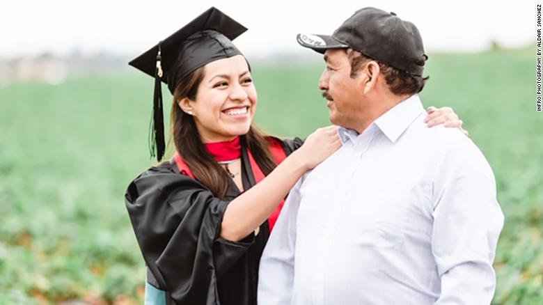 CNN's tweet photo. This college graduate honored her parents in her graduation photos, standing in her cap and gown, in the middle of the fruit fields where her mother still works.

"Their sacrifice to come to this country to give us a better future was well worth it." https://t.co/x4hBAewtqn https://t.co/vYh6UVdlAX