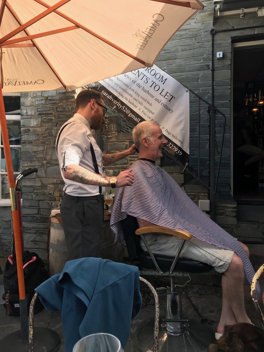 NickD_H's tweet photo. Charity haircut for ⁦⁦@cornwallairamb⁩ outside ⁦@BinTwoPadstow⁩ with a glass of wine in hand. Thanks to Oli at ⁦@GentsQuarter⁩ for all his efforts today. ⁦@AlbertPlace⁩ https://t.co/QEd9Db7mSr