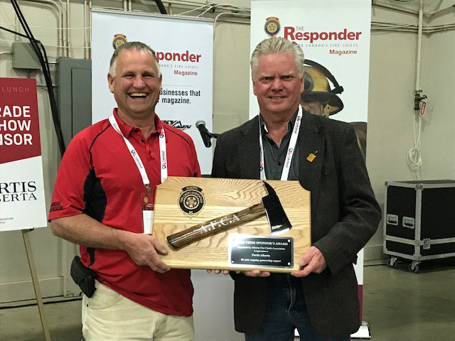 FortisAlberta's tweet photo. Stan is in Red Deer today accepting an award on behalf of FortisAlberta for our continued support of the Alberta Fire Chief’s Association Conference. Thanks for having us there! #AFCA2019 https://t.co/swLocm7c5s