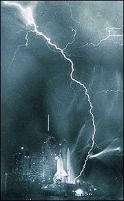 The launch pads in Cape Canaveral have 4 corner lightning rod towers to protect spacecraft. They’re wired together, creating a Faraday cage: a metal screen that protects the rocket from stray currents.Lightning strike while Challenger was on the pad for STS-8. Sam Walton