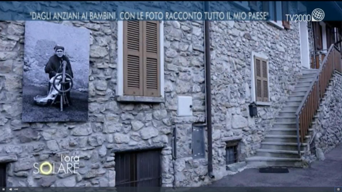 orasolaretv2000's tweet photo. "Mi sono resa conto dopo del valore affettivo che avevo messo in moto con le fotografia agli anziani del paese. #Barni, provincia di #Como, conta 600 abitanti, ma d'estate diventano circa 2000" @giuliacaminada ha scattato #foto in bianco e nero esposte lungo le mura del paese. https://t.co/NzBQ9cQBAC