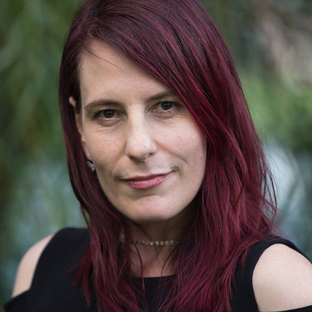 portrait of Dr. Jane Barnette, Associate Professor of Theatre. She smiles slightly and looks directly at the camera.