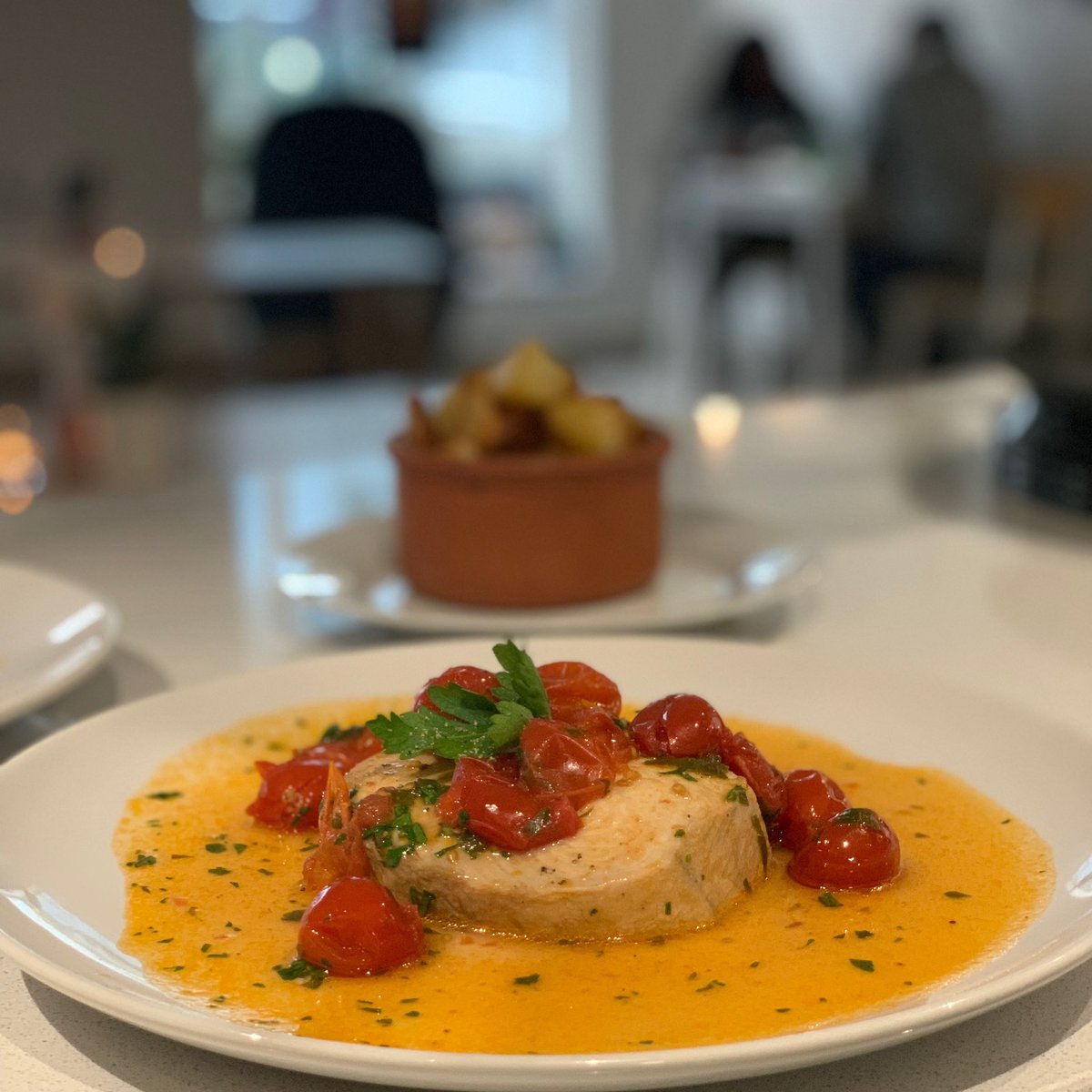 Swordfish poached in Garlic, Cherry Tomatoes and Parsley looking delish for dinner from the Loven Dinner menu. 🍅🐟🌿#lovenbakerycafewinebar
