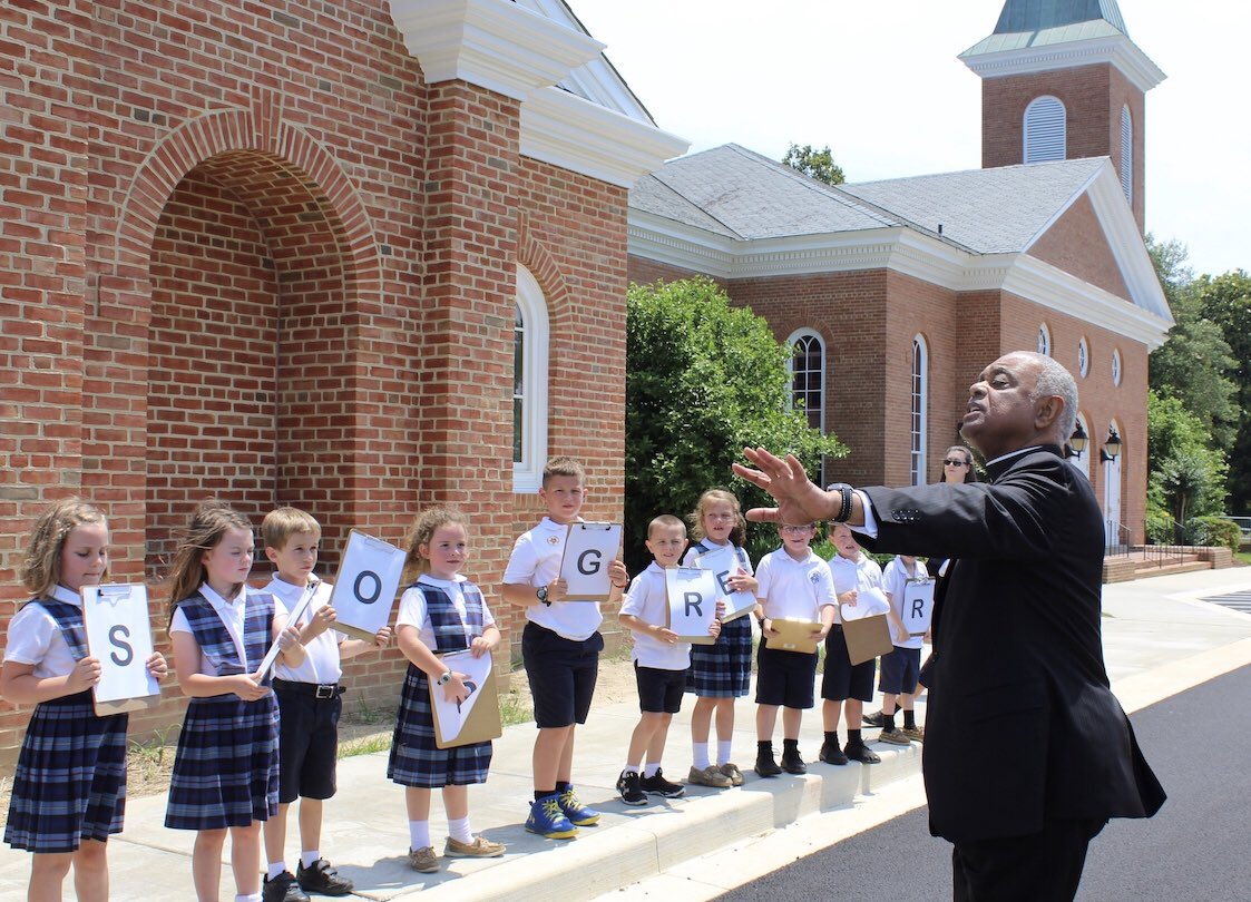 hmfrancisco's tweet photo. @FAWcrusaders 1st gr and PK Ss took a break from the playground at recess today to greet Archbishop Gregory as he arrived for a meeting with SoMD priests @staloysius20650 @WashArchdiocese #ADWSaints https://t.co/RsNxluLokU