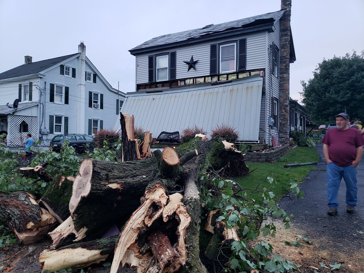 YoderReports's tweet photo. Significant damage in Morgantown proper as well after the reported #Tornado Tuesday evening. Porch roof knocked down. Trees uprooted. Route 23 is currently closed. Reports of a house leveled on Swamp Rd. https://t.co/A1R7gh87uJ