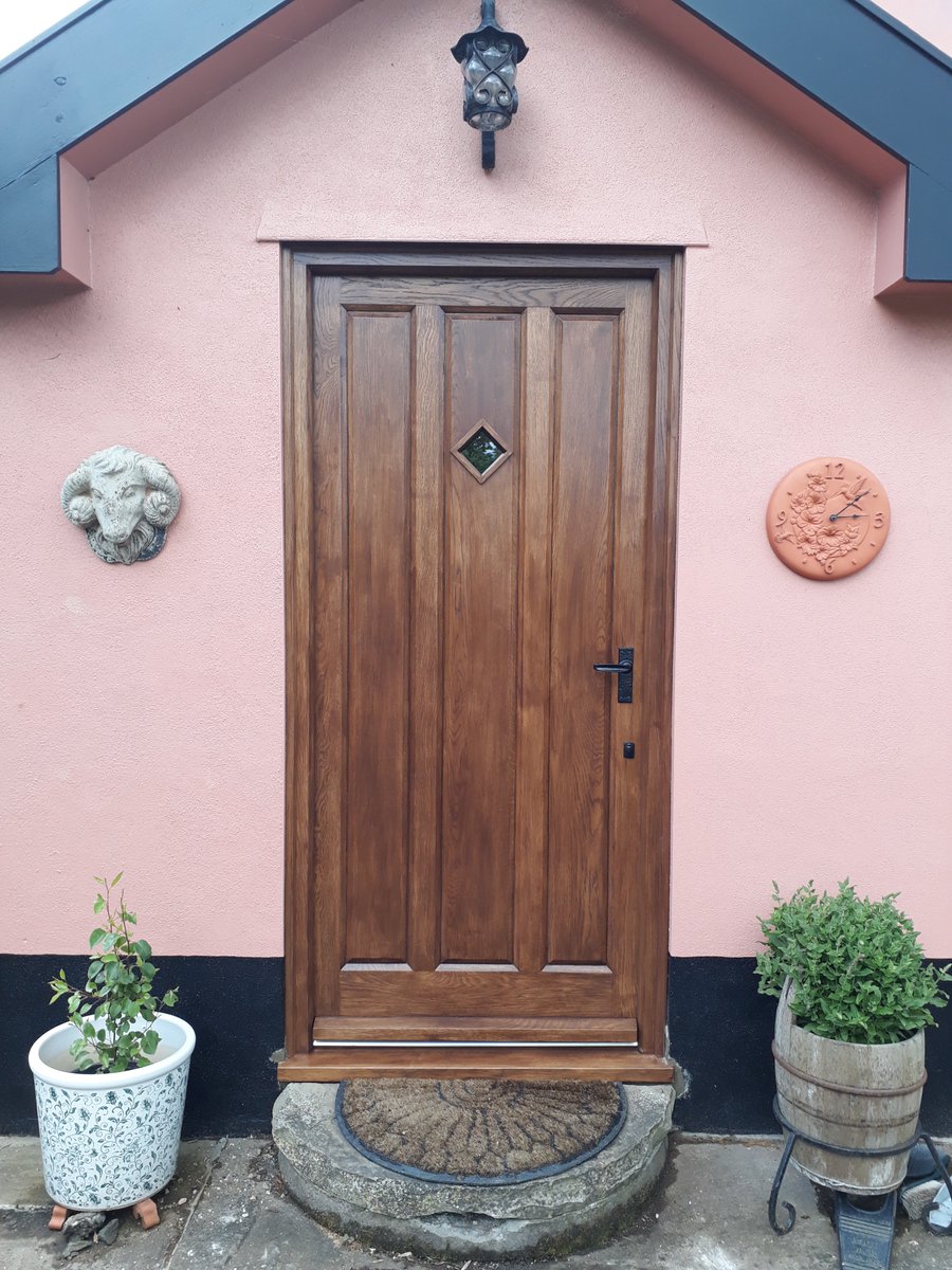 This beautiful solid Oak door is double panelled and insulated with a double glazed vision panel for not only great style but also great aesthetics. A stunningly quirky addition to this home. 
:)