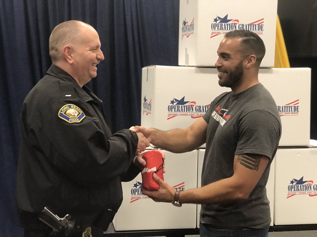 LBPD's tweet photo. This morning @OpGratitude volunteers distributed 850 care pouches to #LBPD officers in appreciation for their dedicated service. Graveyard officers were there to receive the pouches and take them back to their patrol divisions 🤝 #PublicSafetyThroughPartnerships https://t.co/4nVzhIZA3Y