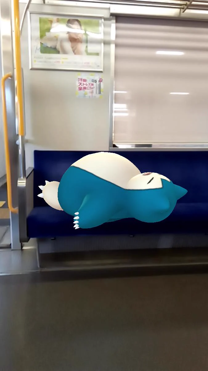 眠っているカビゴンが座席を占領