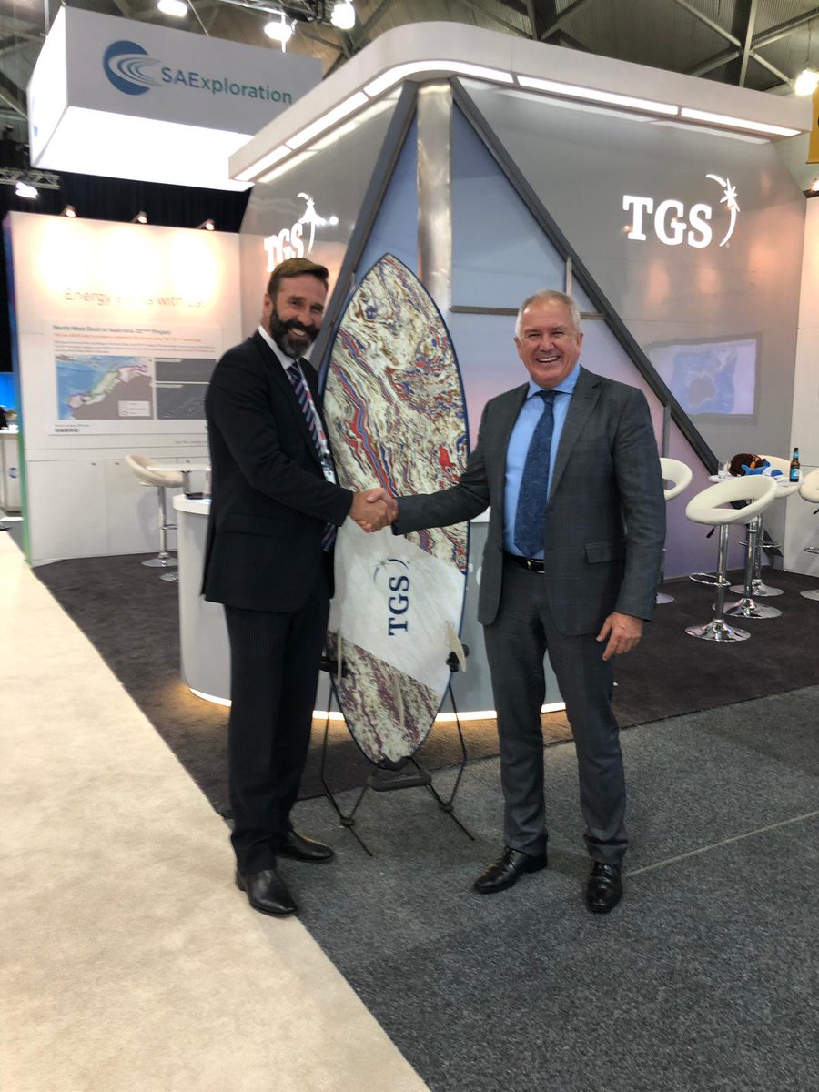 TGScompany's tweet photo. Congratulations to Russell Curtin (left) from Ernst &amp; Young, who received his prize from Paul Young, MD of TGS Asia Pacific, in the TGS  custom-made surfboard competition at APPEA 2019, in Brisbane. #TGS #APPEA2019 @russellcurtin #oilandgas #upstream #SeeTheEnergy https://t.co/XO94BEeiSe