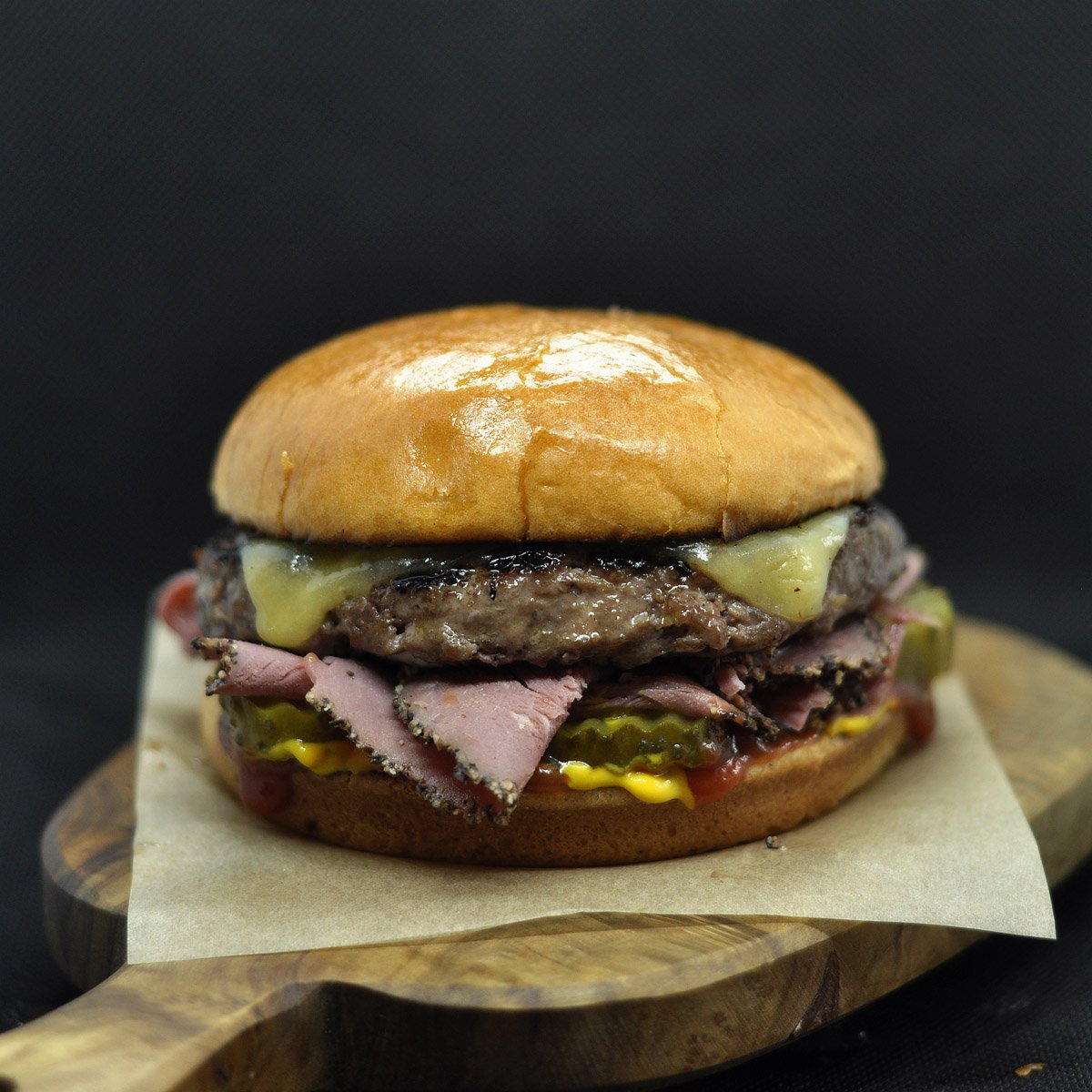 One New Yorker and one Classic please. The New Yorker is always for Dad. Mums don't buy New Yorkers. If they do then something weird is going on. Pastrami, gherkin, mustard, ketchup and cheddar cheese. #burger #catering #streetfood