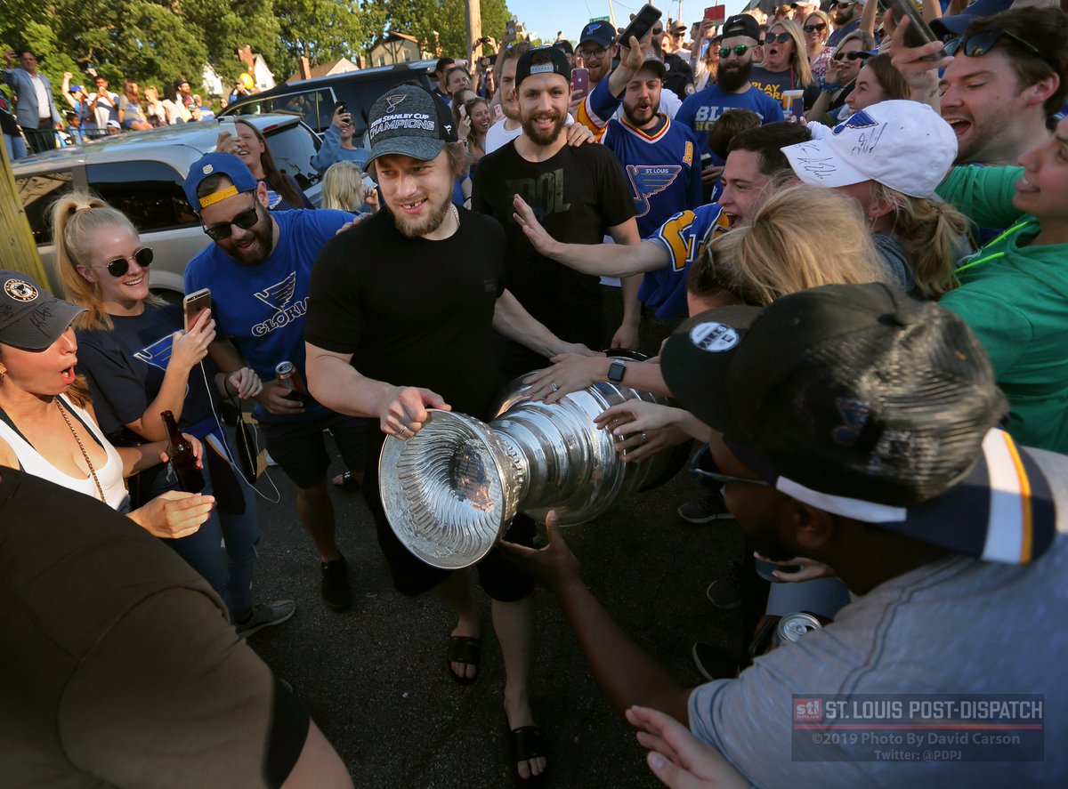 PDPJ's tweet photo. Very cool, Vladimir Tarasenko spots kid in a wheelchair in crowd of 100s outside OB Clark's as Blues players and alumni party &amp; celebrate Stanley Cup victory. Tarasenko points boy brings the cup through crowd to him. https://t.co/1qH6DePbhZ via @stltoday https://t.co/zaQfdazdGr