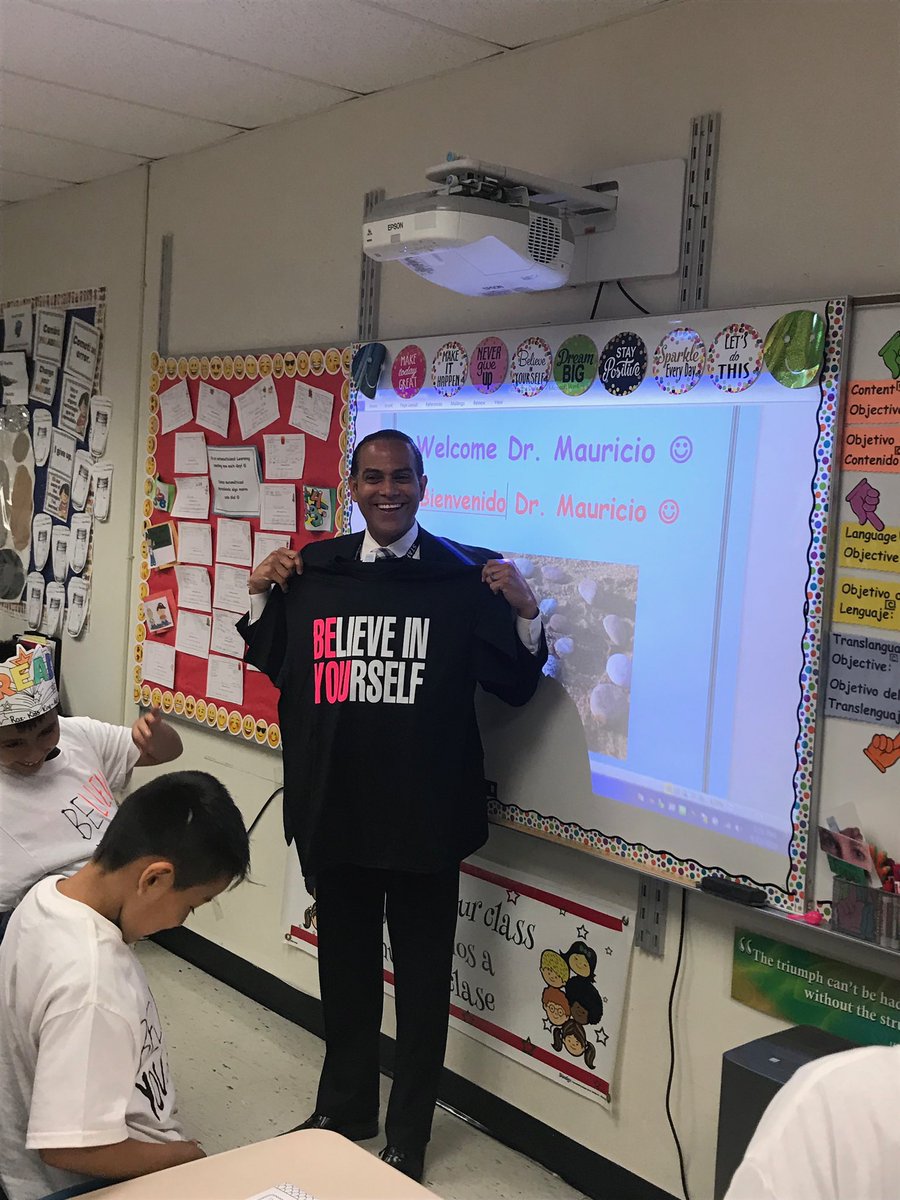 Mrs. Lynch’s 3rd grd #DualLanguage class received a visit from @DrDavidMauricio. He assisted w/ completing their “Big 5 Rocks” project. The students presented him w/a #thankyou gift, a “BElieve in YOUrself” shirt which, he wore proudly. #peekskillpride