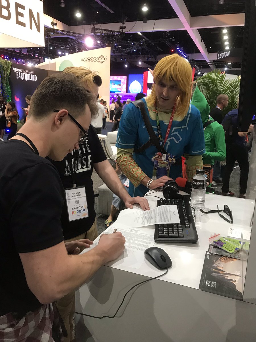 tokkentakker's tweet photo. White Noise dev team signing on-camera release forms for an interview for Electronic Game Information show with host Robby Rackleff on Adult Swim. @egiwithrobby #whyringling #e32019 https://t.co/umId3OuTJf