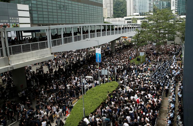 Hundreds of Hong Kong demonstrators storm a key road next to government offices as protests mount against an extradition bill that would allow people to be sent to mainland China for trial. Live feed of the protests: reut.rs/2IbjP4V