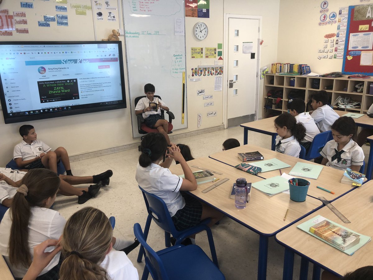 JPS_Year6's tweet photo. Sometimes the pupils can do a better job than their teacher! Members of #JPS6E have taken over reading @RossAuthor book ‘The Nowhere Emporium’ to their classmates. Qasim is bringing the characters to life for us here. #jps_english https://t.co/37B8St7oLL