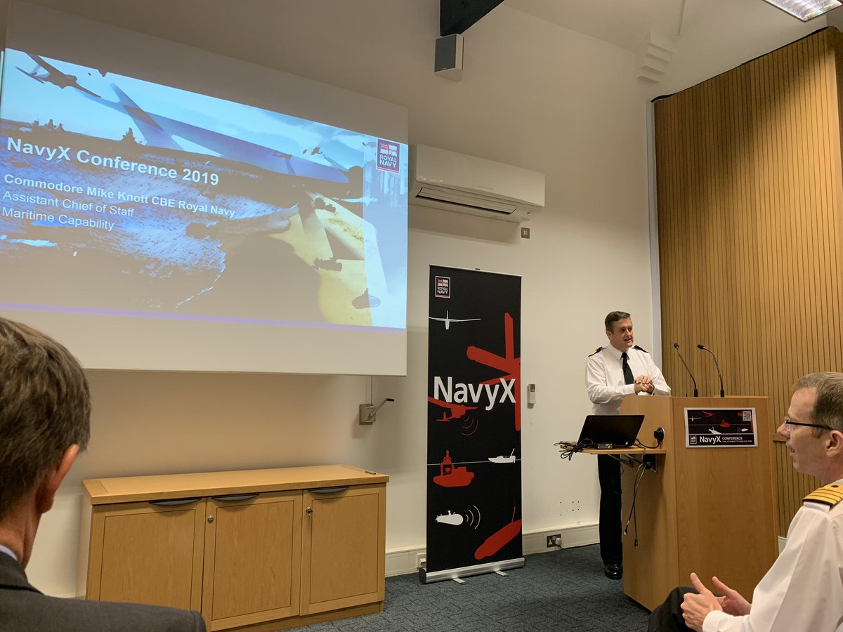 rcvaughan88's tweet photo. Cdre Mike Knott CBE RN delivers the keynote speech at the @RoyalNavy #NavyX conference. 
Defence is trying to transform and modernise- our adversaries are novel in their approach- we must employ autonomy to maintain our advantage.
We need to innovate and operate differently. https://t.co/lIPhn61vPk