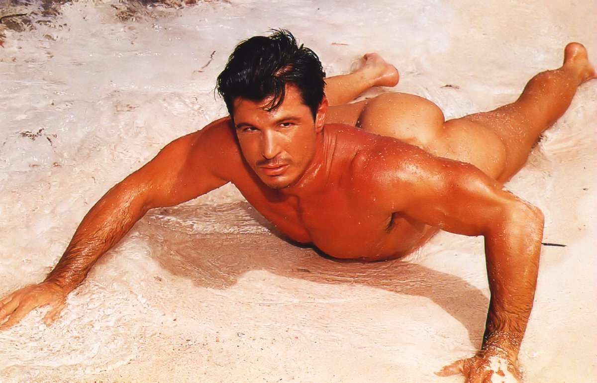 Classic Playgirl centerfold Scott Layne with a sandy beach peach