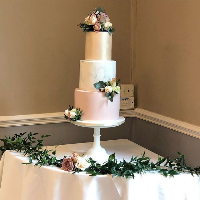 The wedding cake is always a big focus at the reception and for photographs.
.
We framed this gorgeous cake with some lush Italian ruscus and roses that complemented the table centrepieces.
.
Simple but effective, what do you think?
.
#Venuestylist #york… bit.ly/2ZhCbH5