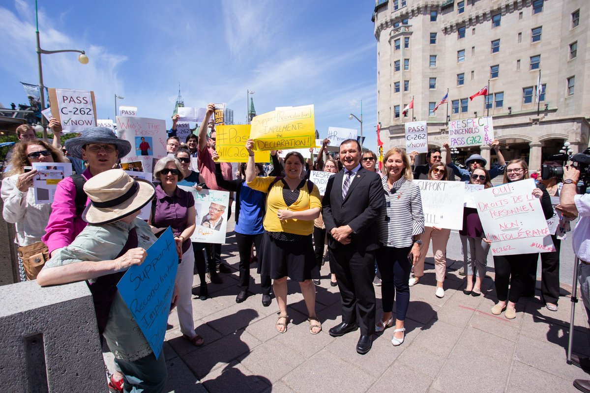 AdoptImplement's tweet photo. Dozens of supporters gathered outside the Senate today to urge Conservative Senators to stop blocking Indigenous rights and pass Bill C262! #senca 3/3 https://t.co/bgK1nNQcsL