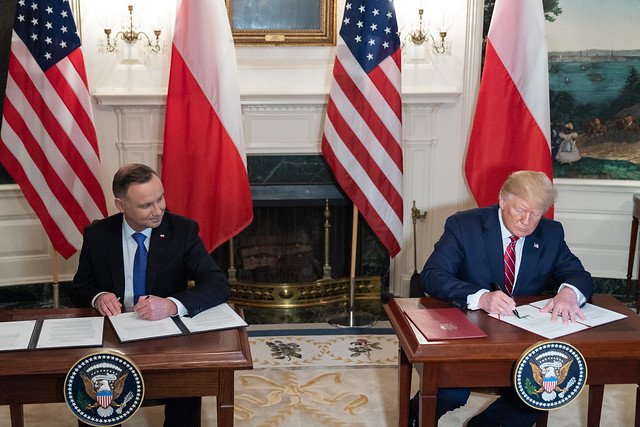 DeptofWar's tweet photo. Earlier today, @POTUS and Polish President Andrzej Duda signed an agreement to increase the U.S. rotational forces in Poland. Learn more about how our two nations will enhance collaboration and strengthen defense ties here: https://t.co/bhQB1jHG91 🇺🇸 🇵🇱 #StrongerTogether https://t.co/X6XDE7vPfi