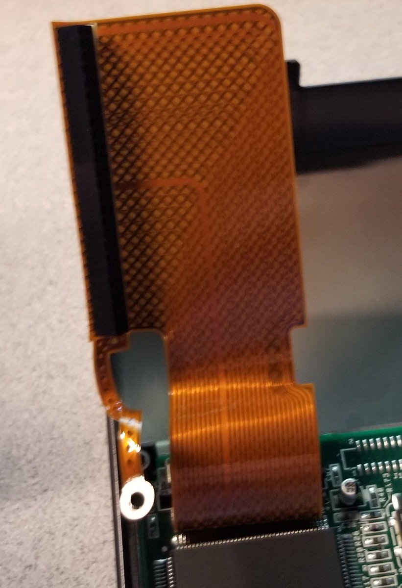 The drive is hooked on this fancy flex cable which includes a grounding strip. That's unusual for these.