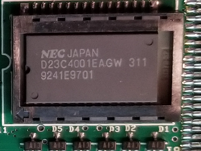 An NEC D23C4001EAGW. I have no idea what this does: NEC chips are always hard to look up.