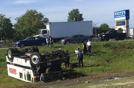 Armored truck rolls over on I-195 in Westport