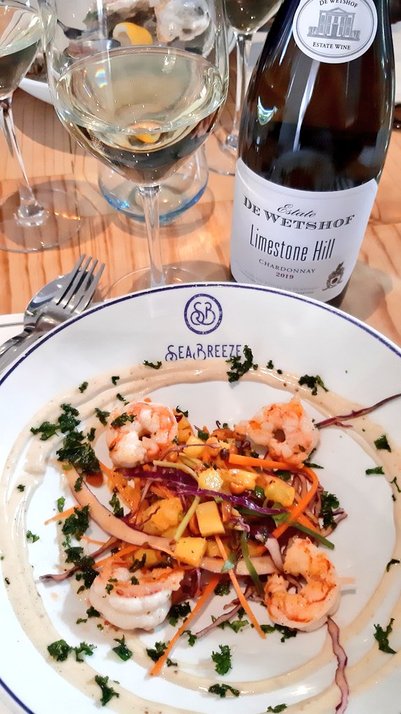 WittyWineWoman's tweet photo. First two courses out at @seabreezeCT today as we celebrate the @dewetshofestate Limestone Hill Chardonnay 2019.
I'm in heaven right now. A fantastic prawn salad and perfectly seared tuna! 😀
#LimestoneHill2019 #LimestoneHill https://t.co/ylm93sTX4N