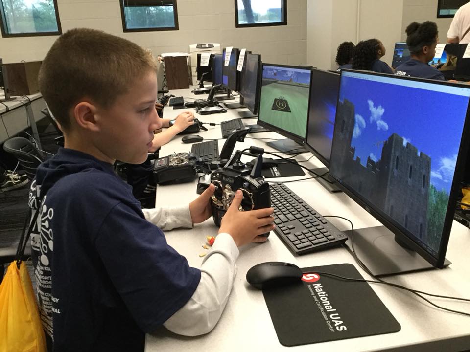 Daytonlibrary's tweet photo. We may have some future Unmanned Aerial Systems pilots! Starting Day 4 off right with a little drone piloting. A big thank you to Sinclair Community College! #DMLCareerAdventures https://t.co/jKhsWK1A1D