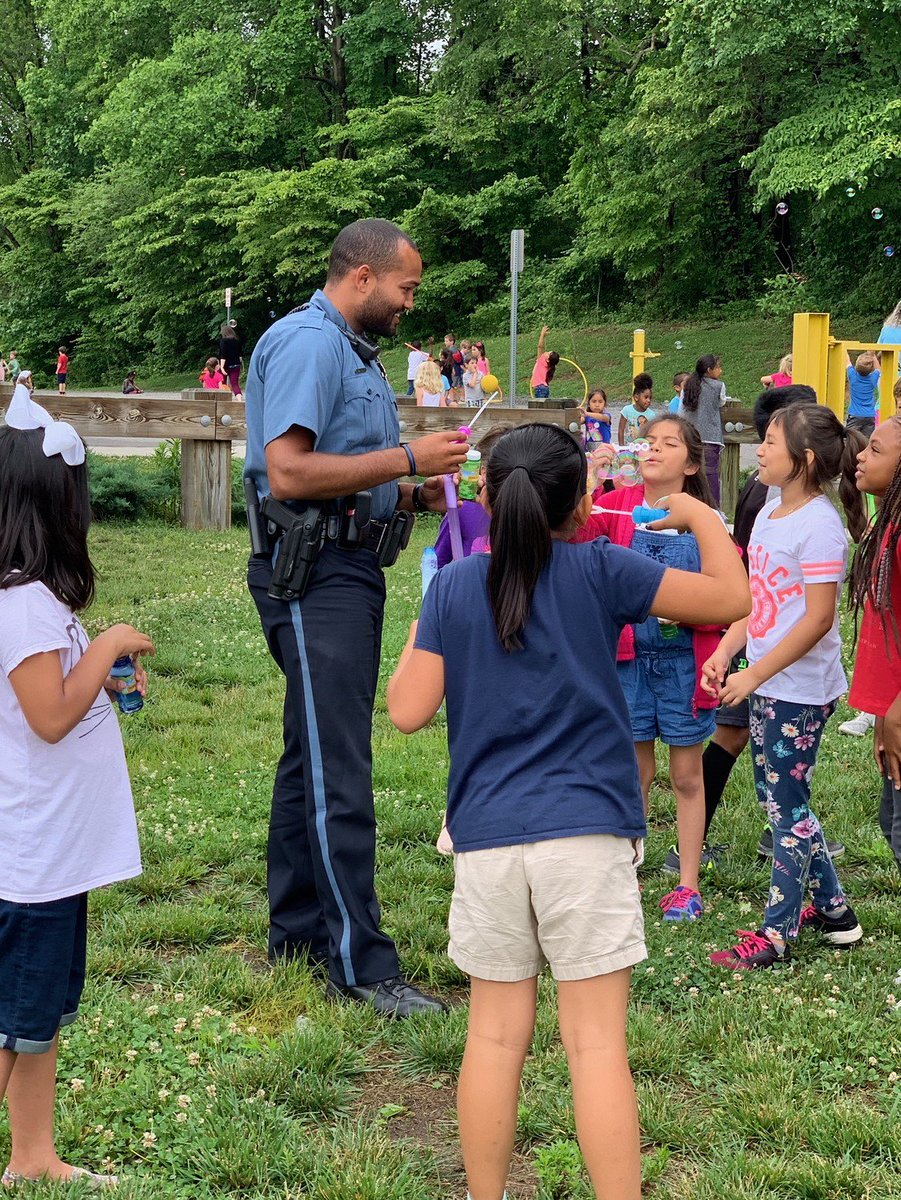 AACOPD's tweet photo. PFC Wood and Officer Ford stopped by Rolling Knolls Elementary School this morning to participate in the end of school year fun! @AACountySchools https://t.co/kDHrUoarWP